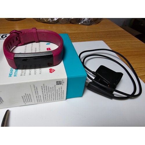 266 - A quantity of 4 various wrist watches which includes a Fitbit Alta HR smart watch, a clean Sector 15... 