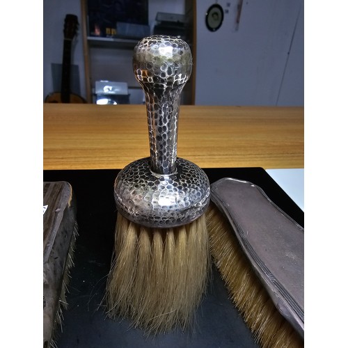 271 - 2x hallmarked silver backed clothes brushes along with a hand hammered white metal handled brush, ap... 