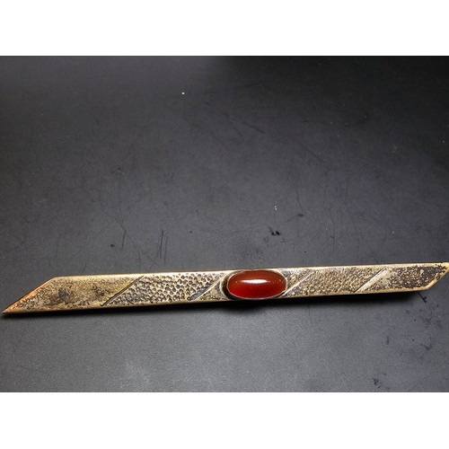 187A - A good vintage genuine arts and crafts sterling silver long bar brooch inset with a pretty red carne... 