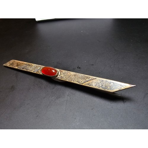 187A - A good vintage genuine arts and crafts sterling silver long bar brooch inset with a pretty red carne... 