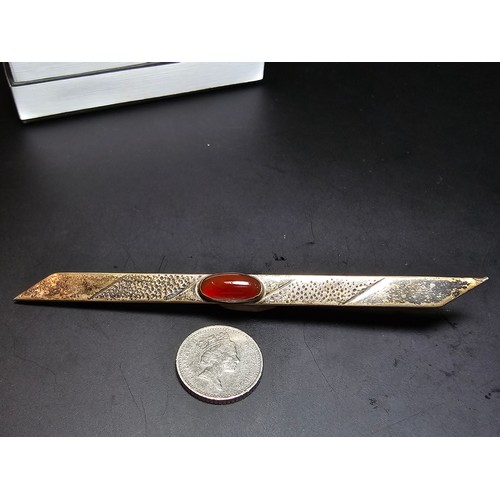 187A - A good vintage genuine arts and crafts sterling silver long bar brooch inset with a pretty red carne... 