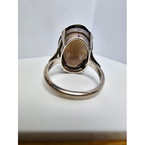 226 - Good quality vintage sterling silver dress ring inset with a large oval faceted natural smokey quart... 