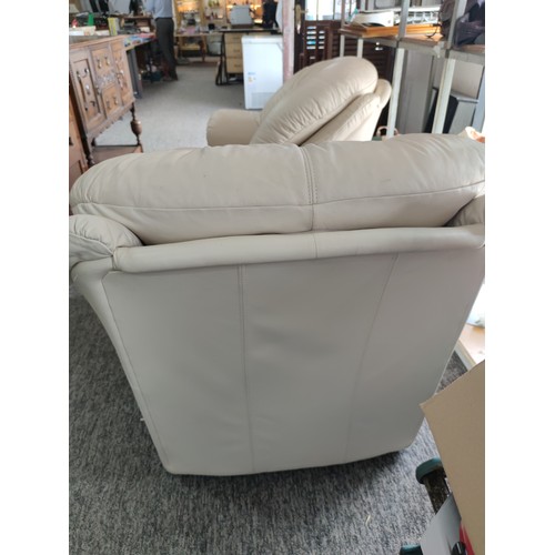 486A - 2x modern cream coloured leather armchairs with wooden accents to the front and in good overall cond... 