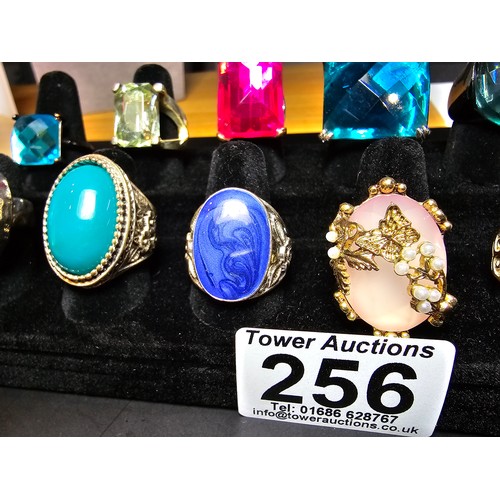 256 - A collection of 12x ornate dress rings, some rings feature large colourful glass stones, 1 ring feat... 