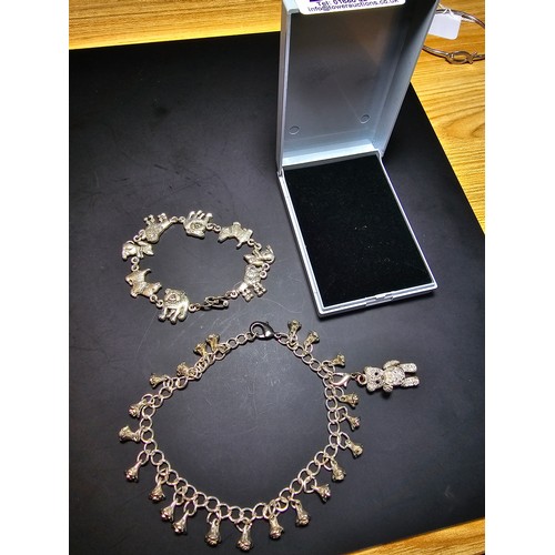 255 - 2x pretty vintage silver plated charm bracelets. One has a rose drop design, with an articulated jew... 