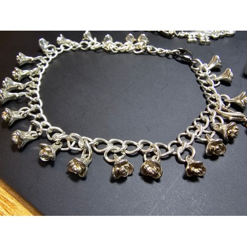 255 - 2x pretty vintage silver plated charm bracelets. One has a rose drop design, with an articulated jew... 