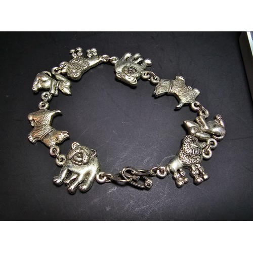 255 - 2x pretty vintage silver plated charm bracelets. One has a rose drop design, with an articulated jew... 