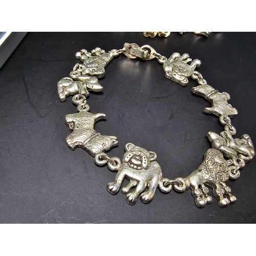 255 - 2x pretty vintage silver plated charm bracelets. One has a rose drop design, with an articulated jew... 