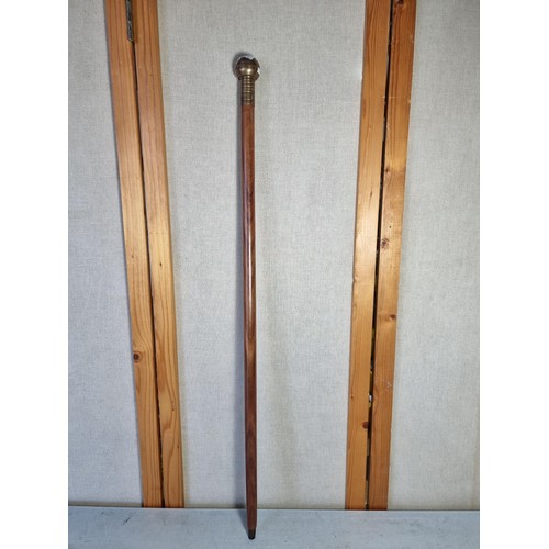 4 - A vintage walking stick in good order with brass top has a compass to the top. stick has a length of... 