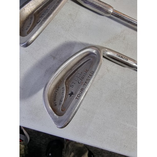 5 - Collection of 8x irons inc 3 - 9 PW, SW, along with a Dunlop putter, irons are all by Steel Classic