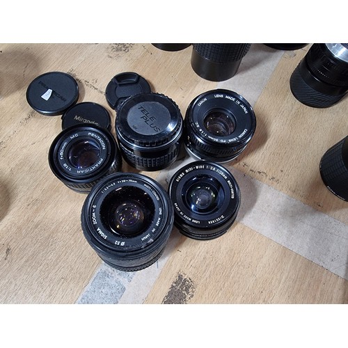 13 - Large quantity of camera lenses of various sizes and models inc Miranda, Soligor, Sirius, Hoya etc p... 