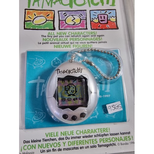 22 - A Bandai Tamagotchi in its sealed case, dated 1996 - 1997