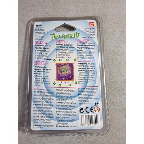 22 - A Bandai Tamagotchi in its sealed case, dated 1996 - 1997