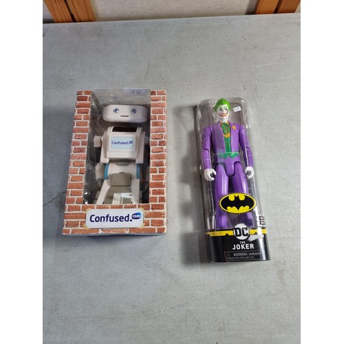 35 - A boxed Brian the confused.com robot in box along with a DC Joker model 1st Edition, model stands at... 
