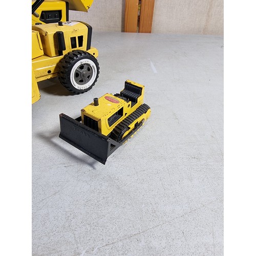 38 - 3x collectable Tonka toys inc a bulldozer T-6 with moveable buckets to the front and back along with... 