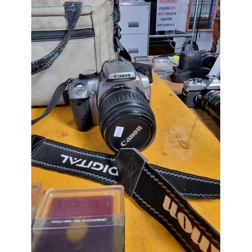 40 - EOS Canon 350D digital lens hood, lens, charger power cable, and accessories along with a MXJVC 6 me... 