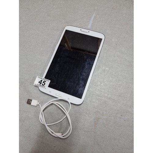 42 - A Samsung SM-T310 mini tablet with charger cable.