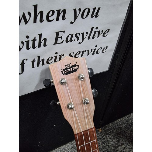 55 - Half size and full size nylon strung acoustic guitars along with a jnr rockstar Ukuele.