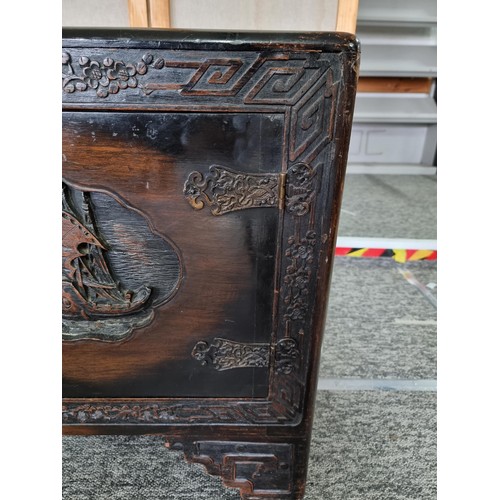 109 - Large Asian Good Quality & Ornate Camphor Wood lidded chest with deep carved decoration to the top o... 