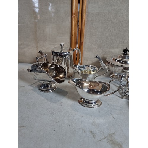 75 - Large collection of silver plated items inc teapot, coffee pot, water jug, milk jugs, gravy boats, s... 