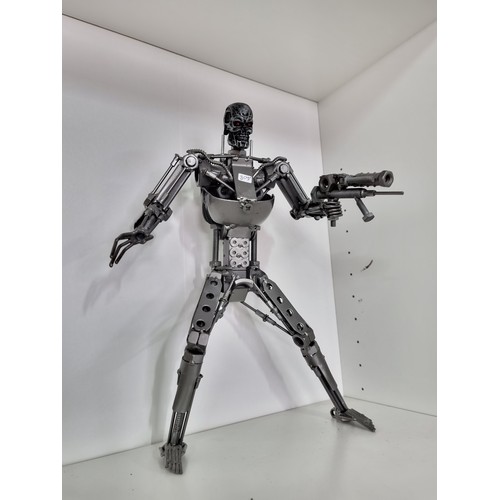 102 - Collection of two nuts and bolts metal figures inc the Terminator and  the Preditor both very well e... 