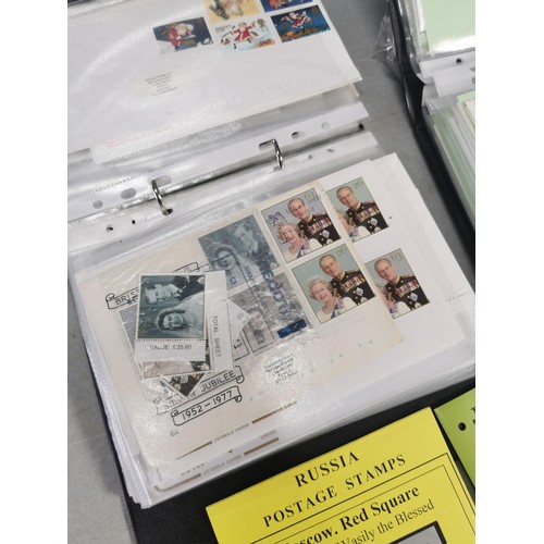 101 - Collection of 3x albums containing a quantity of first day covers along with a tin of loose stamps a... 