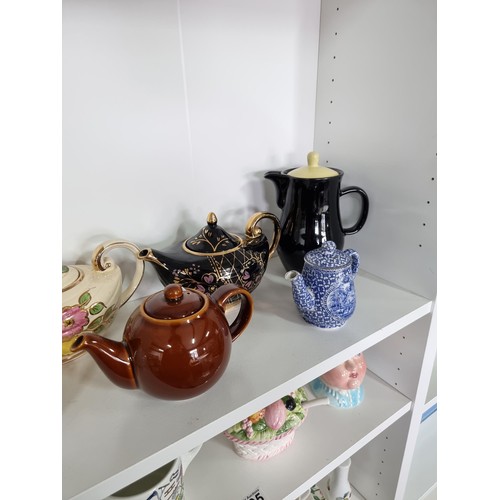 105 - Large quantity of collectable ceramics inc 4x teapots inc a black Arthur Wood teapot, a cream Aladdi... 