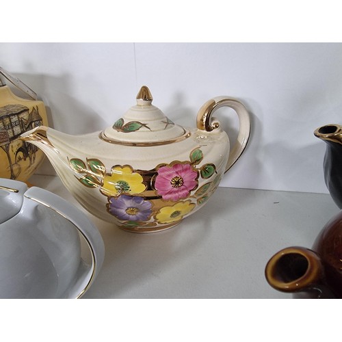105 - Large quantity of collectable ceramics inc 4x teapots inc a black Arthur Wood teapot, a cream Aladdi... 