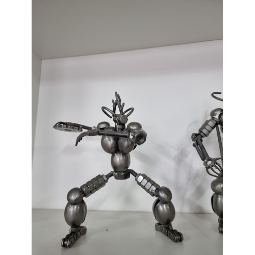 106 - 2x nuts and bolts figures of Predator style figures both in good order tallest piece stands at 27cm ... 