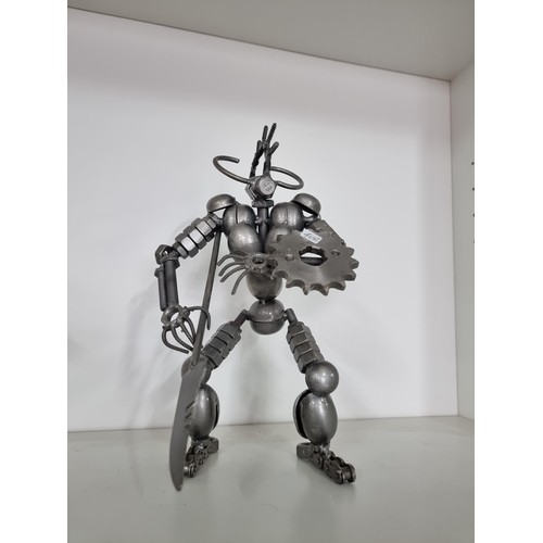 106 - 2x nuts and bolts figures of Predator style figures both in good order tallest piece stands at 27cm ... 