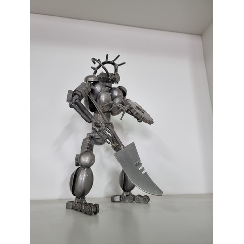 106 - 2x nuts and bolts figures of Predator style figures both in good order tallest piece stands at 27cm ... 