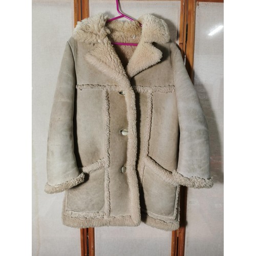128 - A genuine sheepskin jacket with wool lining by Baily's of Glastonbury in good overall condition size... 