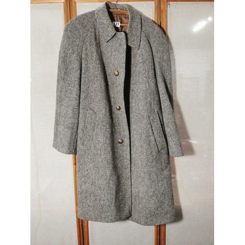 131 - A good quality long gents coat by Dunn and Co, Harris Tweed in good order 100% wool
