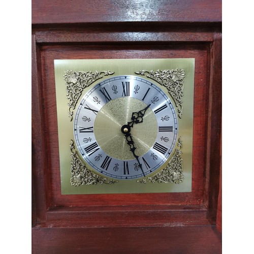 140 - Modern granddaughter quartz clock complete with pendulum, with weights at the back for decoration in... 