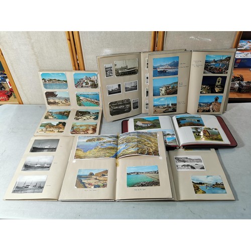 153 - A collection of vintage photographs and postcards inc a good quality reference book album with key e... 