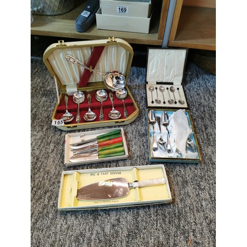 155 - 5x boxes containing a variety of flatware inc a case fruit spoon set, cased cake knife, cased coffee... 