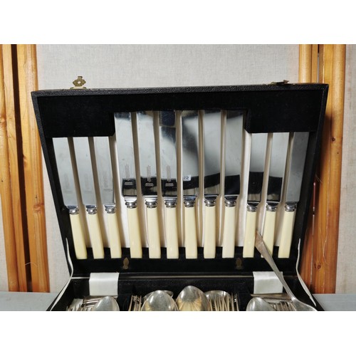 165 - A cased complete 6 person plated cutlery set by Winegartens inc teaspoons, knives, forks, salad fork... 