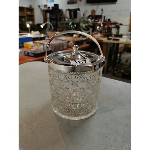 167 - A silver plated biscuit barrel in cut glass with lid along with a large Livivo champagne bucket all ... 