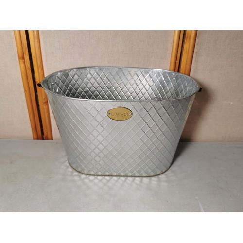 167 - A silver plated biscuit barrel in cut glass with lid along with a large Livivo champagne bucket all ... 