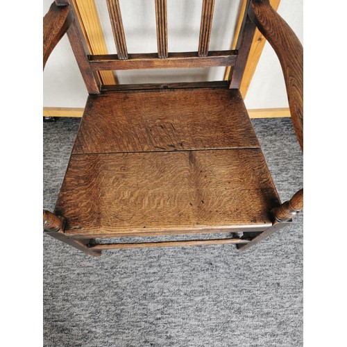 447 - A lovely quality antique Welsh solid elm carved country arm chair, the chair presents an excellent g... 