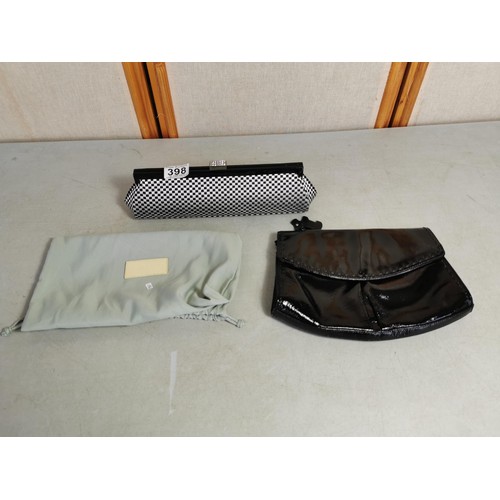 398 - A good quality black patent clutch bag along with a Dune evening bag with pale green dust bag.