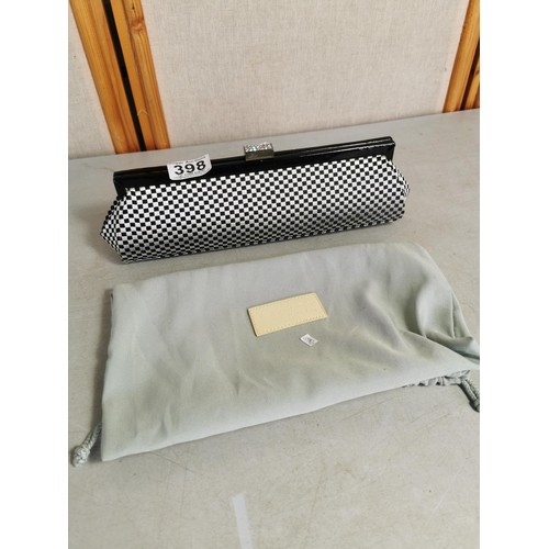 398 - A good quality black patent clutch bag along with a Dune evening bag with pale green dust bag.