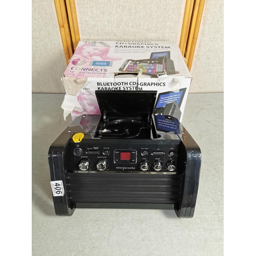 406 - Bluetooth CD+Graphics Karaoke system in box complete with all cables remote etc model EKS213/4BT.