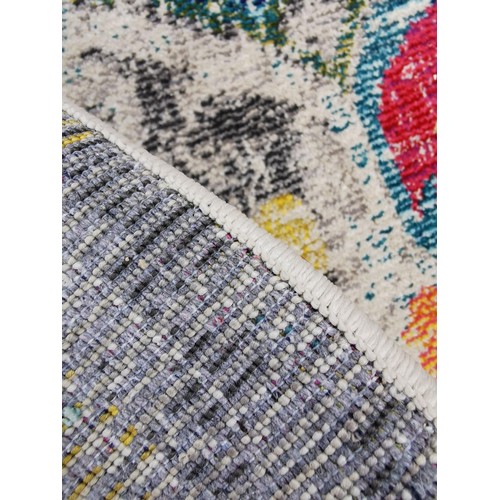 408 - A large Safavieh multicoloured rug made in Turkey, in the Monaco design, in good order with no rips ... 