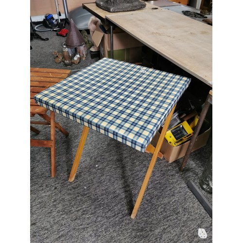 410 - 2x good quality fold up tables one with blue check wash off top, largest measures 69cm high 56cm squ... 