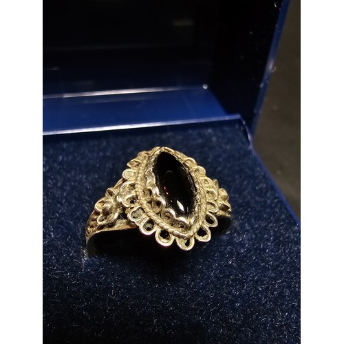 220 - A good vintage 925 sliver ring with an ornate design inset with a black onyx stone in good clean con... 