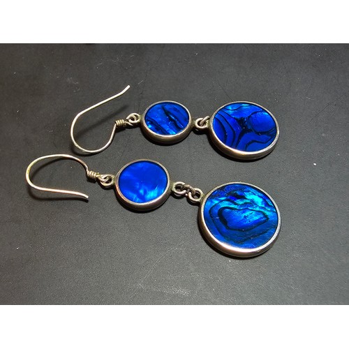 223 - A pair of pretty 925 silver long drop earrings inset with colourful blue abalone shell which is doub... 