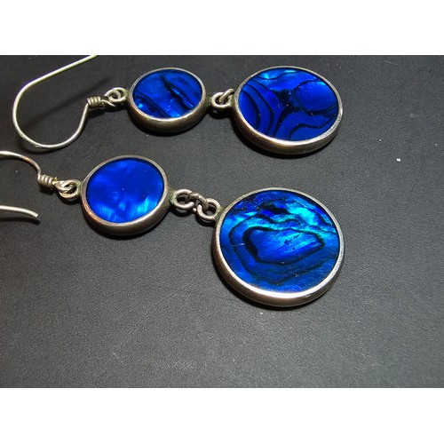 223 - A pair of pretty 925 silver long drop earrings inset with colourful blue abalone shell which is doub... 