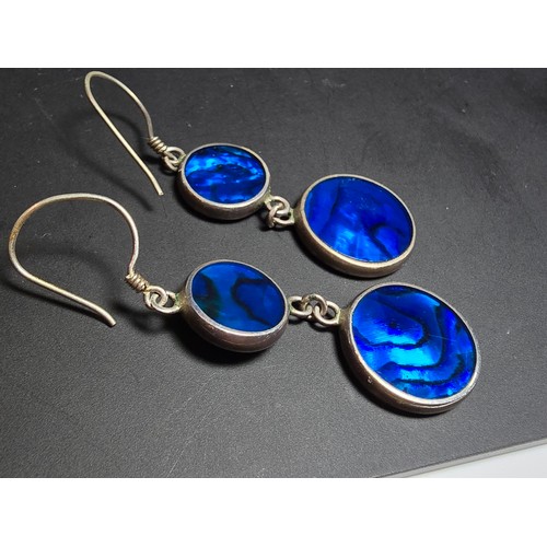 223 - A pair of pretty 925 silver long drop earrings inset with colourful blue abalone shell which is doub... 