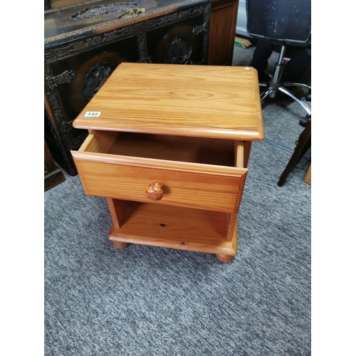 448 - Small pine one draw bed side table with a shelf at the base. Total height 59cm width of 50cm with a ... 